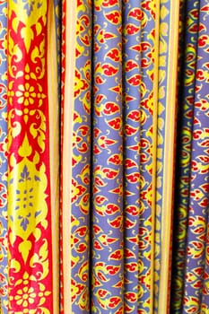 The colorful antique Thai fabric decorated as curtain.