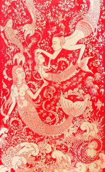 The beautiful Thai pattern on a wall of temple in the mermaid pattern.