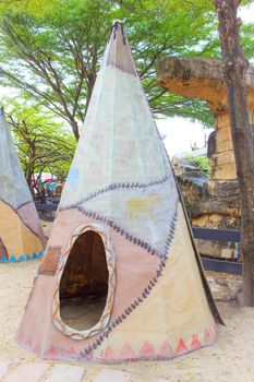 A Tipi teepee or tepee - Indian tent in the forest.