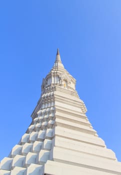 The beautiful white pagoda on blue sky as background.