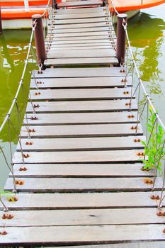 Wood bridge across the boat for a short distance.