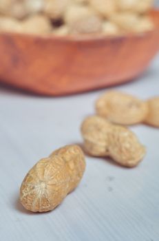 Peanuts in a brown bowl