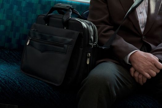 Japanese Businessmen sitting on seat in train