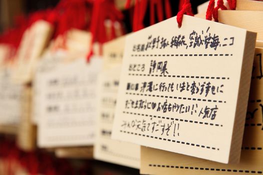 Ema prayer tables at a shrine in Ueno Park In Japan ,Pray for happiness,good life , healthy , luck by write praying word in wooden tablet.