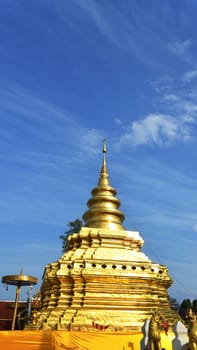 Phra That Sri Jom Thong, Series 1_1, Golden Pagoda with Cloud and Blue Sky.Chiang Mai province, Thailand.