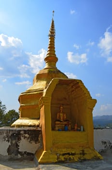 Golden Phra That on Hill above Village Series 1_2, Buddha Image, Cloud and Blue Sky, Chiang Mai province, Thailand