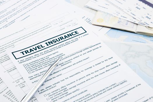 travel insurance form, passport and tickets on world map paperwork, concept and idea for insurance business