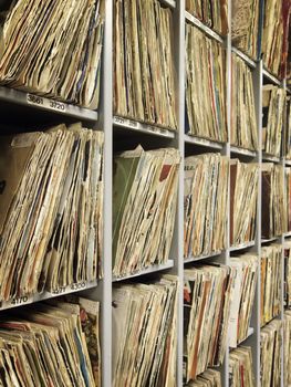 Rack of vinyl records. Selective focus background.