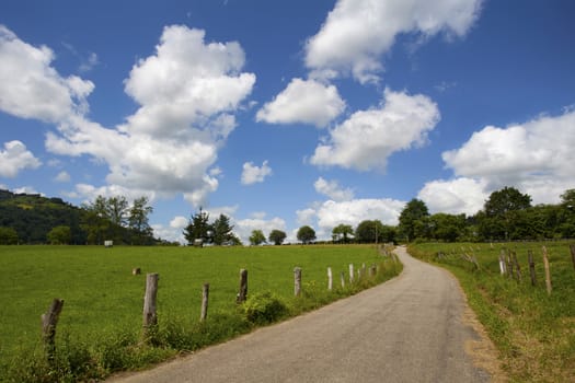 Rural road and cloudscape in North Spain. Asturias. Spain