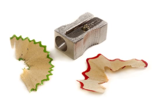 Pencil Sharpener and shavings. Isolated in white.