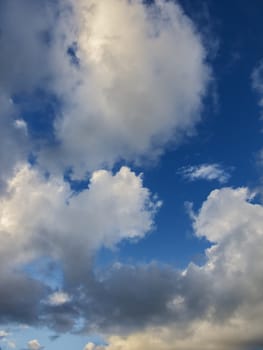 White fluffly clouds against a blue background