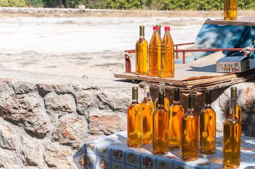 Bottles of croatian homemade wine prosek on a stall