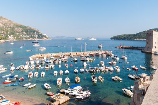 Boats moored in old town pier of Dubrovnik