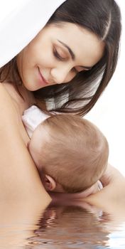 picture of happy mother with baby in water