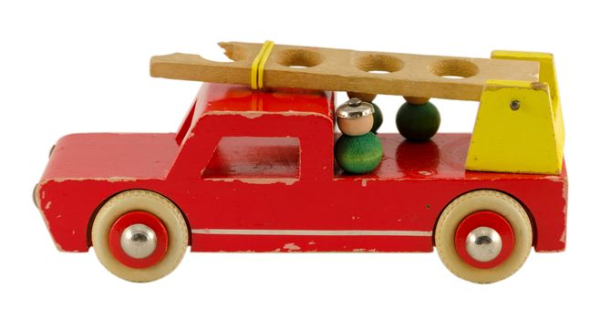 antique wooden fire-engine toy isoalted on white background