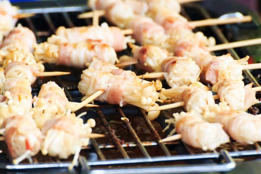 Enoki Mushrooms, wrapped with pork bacon, grilled on the stove.