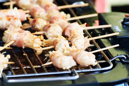 Enoki Mushrooms, wrapped with pork bacon, grilled on the stove.