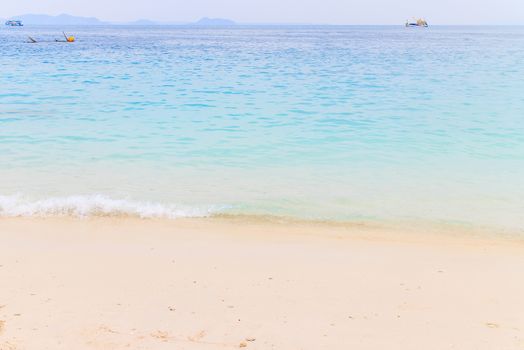 Soft wave of the sea on the sandy beach.