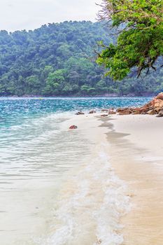 Soft wave of the sea on the sandy beach.