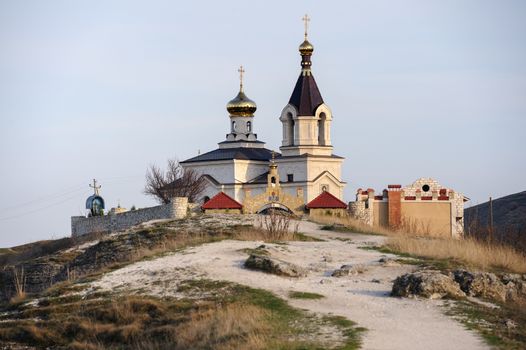 Christian Orthodox church in Old Orhei, Moldova, in rays of sunset