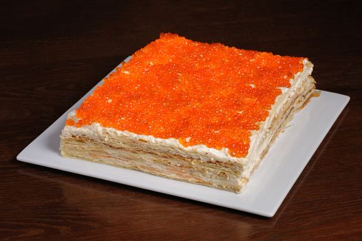 closeup of layered pie made with red caviar