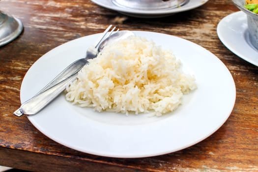 Steamed rice in a white dish ready to eat.