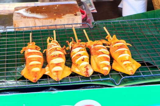 Many of grilled squid in thai market.