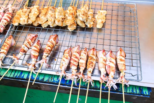 Many of grilled squid in thai market.
