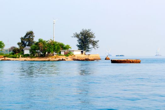 Small island in the middle of the sea.