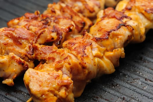 preparation of chicken shish kebab on skewers