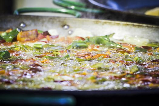 detail making paella in a medieval fair, Spain