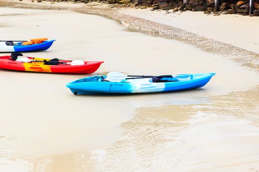 Colourful kayaks on tropical beach at KohKood, thailand.