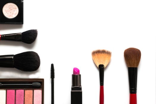 makeup brush and cosmetics, on a white background isolated