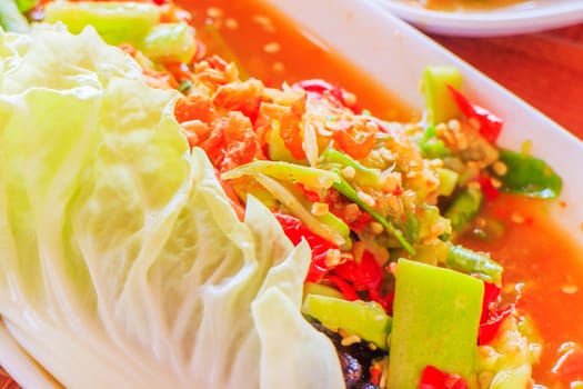 Thai papaya salad hot and spicy mixed from variety of vegetable.