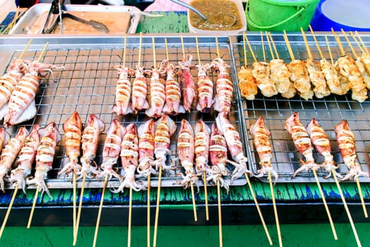 Many of grilled squid in thai market.