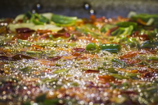 detail making paella in a medieval fair, Spain