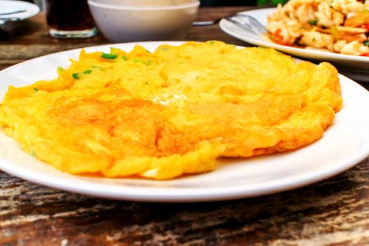 Thailand style omelet served on a plate.