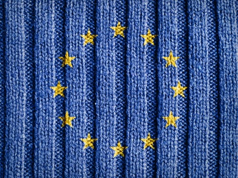 Close-up view of wool fabric pattern with the flag and emblem of Europe. European Union background.
