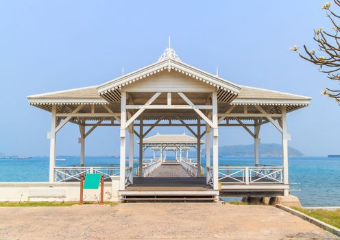 Pavilion made of wood in the middle of the sea.