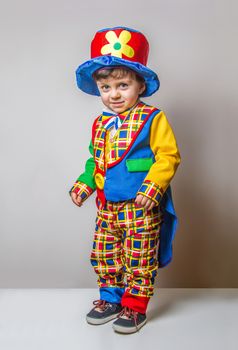 Funny Child wearing a clown suit