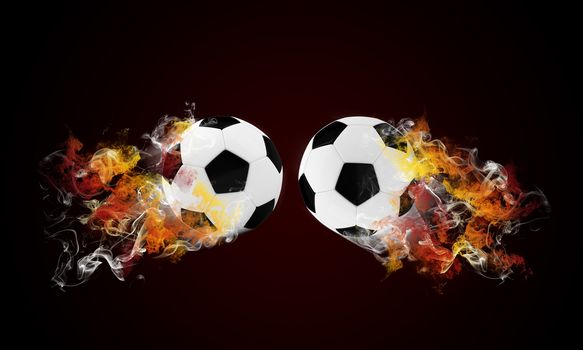 Two soccer ball in the color of flame and smoke. Sport concept