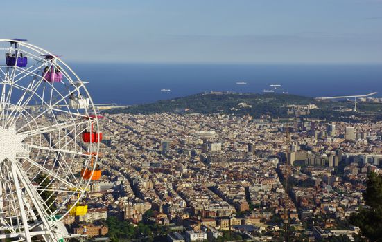 Barcelona, Spain - 2014, April 27: People on a huge ferris wheel with panoramic view over Barcelona.  On April 2014 in Barcelona, Spain.