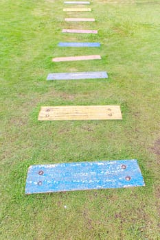 Walkway made ������of bricks in various colors at garden.