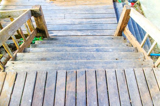 Old wooden stairs is way down at the home garden.