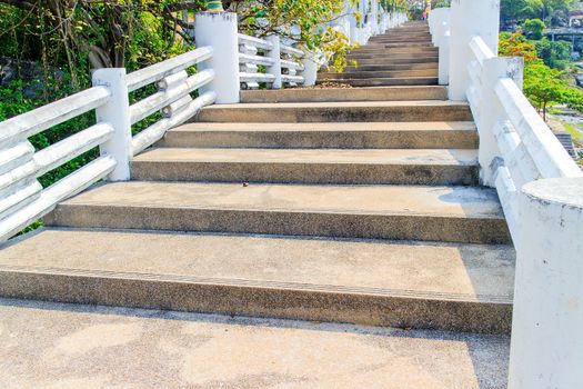 Old concrete stairs is the overpass in the sea view.