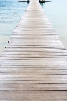 Wooden jetty over sea travel in the holidays.