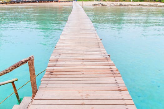 Wooden jetty over sea travel in the holidays.