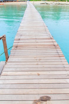 Wooden jetty over sea travel in the holidays.