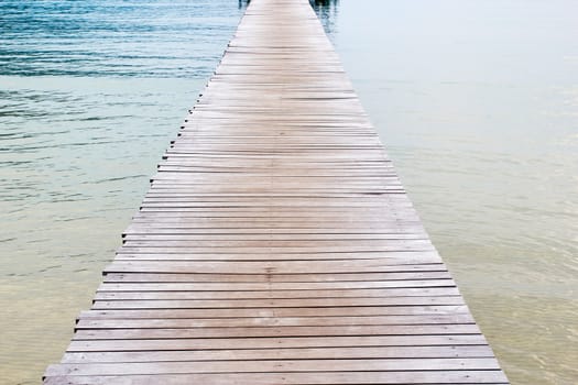 Wooden jetty over sea travel in the holidays.