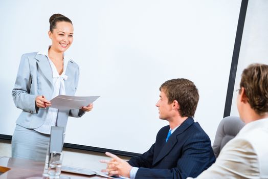 image of a discusses business woman with colleagues